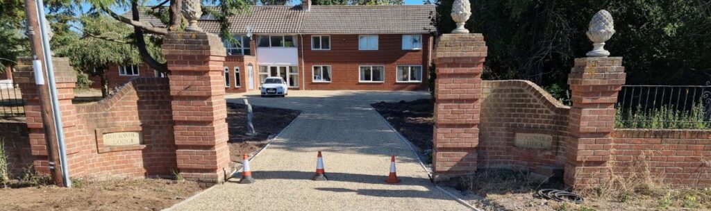 This is a photo of a newly installed chip and tar driveway, installed by Godmanchester Driveways